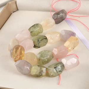 Macro shot of multi-colored faceted natural quartz and crystal beads for jewelry making