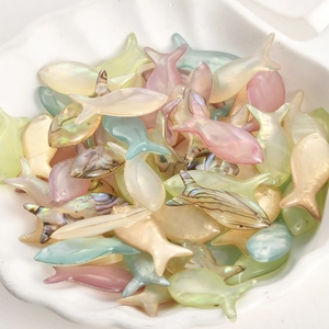 Iridescent shell-like fish charms in various pastel colors for DIY jewelry making