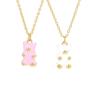 Cute colorful gummy bear pendant necklaces in pink and white enamel with gold details