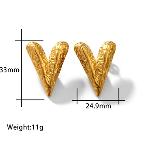 Detailed view of 18K gold plated stainless steel heart earrings with textured finish