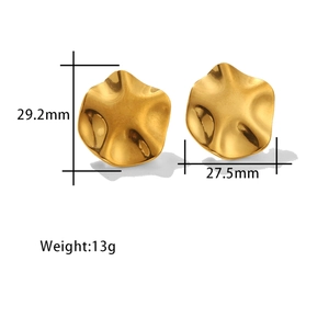 Macro shot of gold-plated earrings with irregular pleated texture showing 29.2mm size