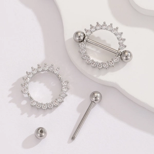 Detail of 18K gold plated stainless steel nipple shield with cubic zirconia insets