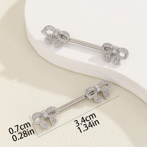 Detail of silver bow nipple ring with white zircons showing 3.4cm length dimension