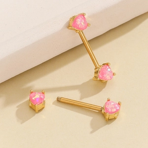 Detail of pink heart-shaped opal nipple ring in 18K gold plated stainless steel