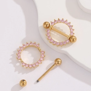 Macro detail of 18K gold stainless steel nipple ring with pink zircon halo and components