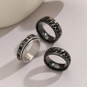 Detailed close-up of retro stainless steel rings with Roman numerals and chain inlay