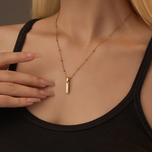 18K gold plated stainless steel shell letter pendant necklace on a beaded chain