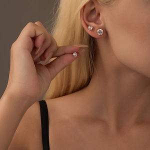 18K gold plated stainless steel zircon stud earrings in three sizes on ear model