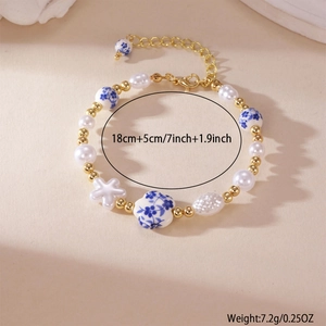 Blue and white porcelain heart pearl beaded bracelet with gold flower charms