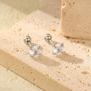 Detail of silver stainless steel stud earrings with round zircon and ball screw back