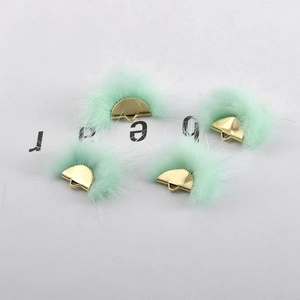 Detailed view of mint green fan-shaped mink fur pendants with gold metal loops for DIY