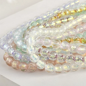 Perle in vetro pastello con finitura aurora e texture craquelé per gioielli fai-da-te
