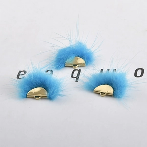 Three sky blue faux fur fan-shaped pendants with gold metal bases for DIY earrings