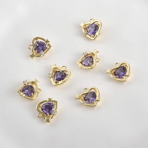 Detailed view of 14k gold-plated heart charms with purple cubic zirconia for DIY jewelry