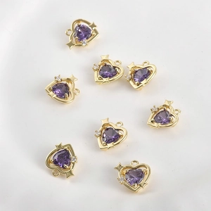 Eight gold-plated heart charms with purple cubic zirconia and tiny star details for jewelry