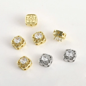 Detailed view of hollow square charms with cubic zirconia for DIY jewelry making