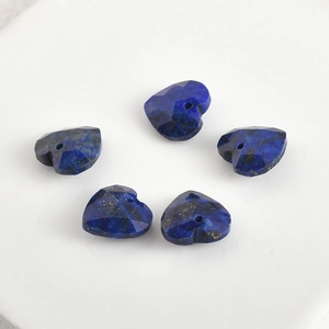 Macro shot of 13mm faceted heart-shaped lapis lazuli beads for DIY jewelry making