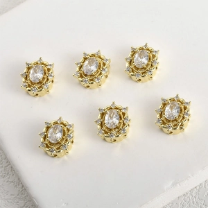 Detail of 14k gold-plated floral oval charms with cubic zirconia for DIY jewelry making