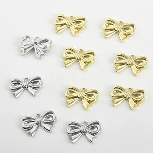 Bow-shaped 14k gold-plated metal pendants for DIY jewelry making in gold and silver colors