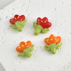 Handmade glass tulip flower beads for jewelry making in vibrant red and orange colors