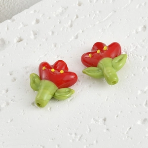 Macro shot of handmade red glass tulip flower beads for DIY jewelry and necklaces