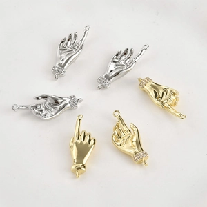 Detailed view of 14k gold-plated palm charms with micro-pave zircon for DIY jewelry