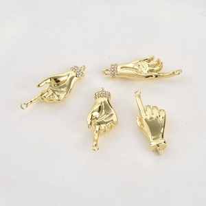 Detailed view of 14k gold-plated hand gesture pendants with zircon settings for DIY jewelry