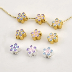Detailed macro view of 18k gold enamel flower beads for DIY jewelry bracelet making