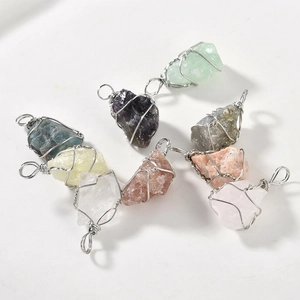Handmade wire-wrapped natural raw crystal stone pendants set in various vibrant colors