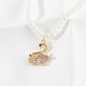 14k gold filled swan pendant with pink marquise crystals and white pearl necklace