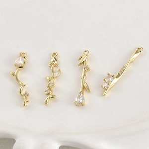 14k gold plated rose and bamboo flower pendants set with clear cubic zirconia stones