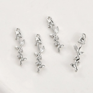 Detailed view of 14k gold-plated rose pendants with sparkling cubic zirconia accents