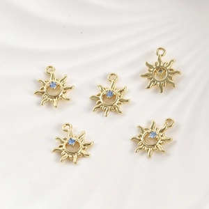 Set of five 14k gold plated sun charms with light blue cubic zirconia for jewelry making