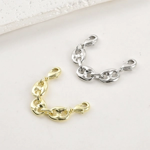 Close-up of 14k gold-filled pig nose connector links with double lobster clasps