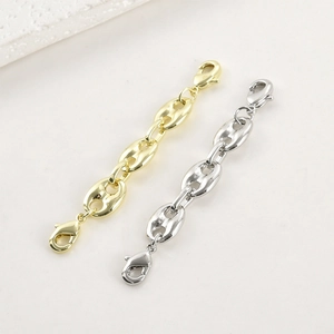 Detail of 14k gold and silver pig nose chain extensions with lobster clasps for jewelry