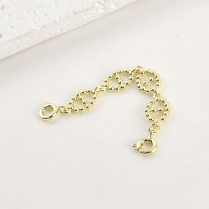 Detail of 14k gold-filled pig nose chain extender with spring clasps and beaded links