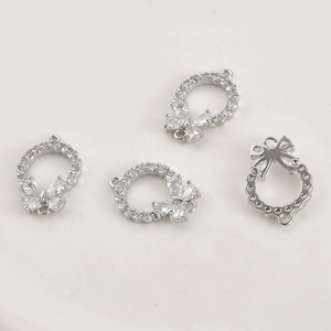 Macro detail of 14k gold-plated butterfly ring connectors with cubic zirconia for DIY jewelry