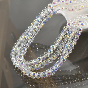 Close-up of rainbow aurora crystal glass beads with vibrant iridescent reflections