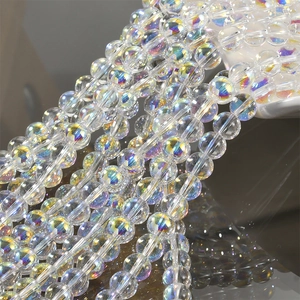 Macro shot of iridescent mermaid bubble glass beads with rainbow coating for DIY jewelry