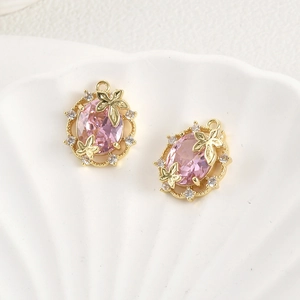 Macro shot of pink zircon leaf oval pendants with 14k gold plating for DIY jewelry making
