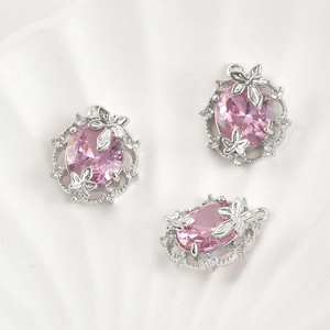 Detailed macro view of 14k gold plated pink zircon leaf oval pendant for DIY jewelry