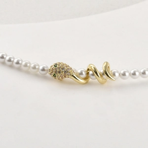 14k gold plated snake pendant necklace with white pearls and sparkling cubic zirconia