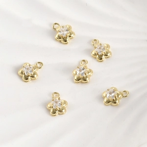 Set of 6 gold flower charms with star-cut zircon centers for DIY jewelry making