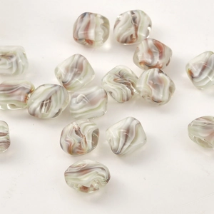 Macro shot of square cream-colored swirled glaze beads for DIY handmade jewelry making