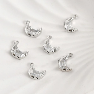 Detailed view of silver moon charms featuring rectangular zirconia and top hanging loops