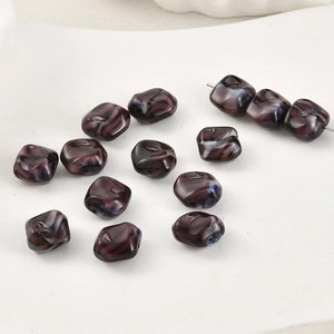 Macro shot of irregular square glass beads with purple and black marble texture for DIY jewelry
