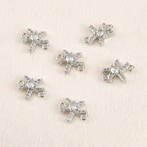 Detailoverzicht van zes vliegtuigconnectoren met zirkonia voor DIY-sieraden maken