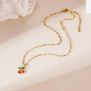 Vintage 18K gold-plated cherry pendant necklace with red and green crystals on a thin chain