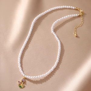 Elegant multi-layer pearl necklace with purple tulip flower pendant and golden lobster clasp