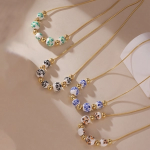 New Chinese style ceramic bead necklaces with 18K gold plated beads in four floral colors